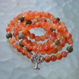 Tree of Life & Orange Agate Mala Necklace featuring 108 hand-knotted beads, designed to activate the Sacral Chakra for creativity and balance, associated with Leo and Virgo.