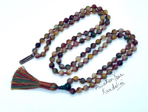 A Multicolored Agate Mala Beads Necklace featuring 108 hand-crafted agate beads, designed to balance the Root and Sacral Chakras, enhancing grounding and creativity, and resonating with Taurus and Gemini zodiac signs.