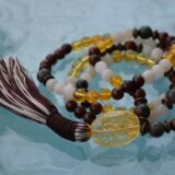 Bloodstone, Mahogany Obsidian, and Moonstone Mala Necklace featuring 108 hand-knotted beads, designed for grounding, protection, and emotional balance. Resonates with Aries and Scorpio zodiac signs.