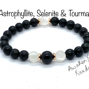 Rare Astrophyllite Selenite & Tourmaline Mala Bracelet featuring genuine Astrophyllite, Selenite, and Black Tourmaline beads, designed for Root and Crown Chakra balance and Capricorn birthstone support.