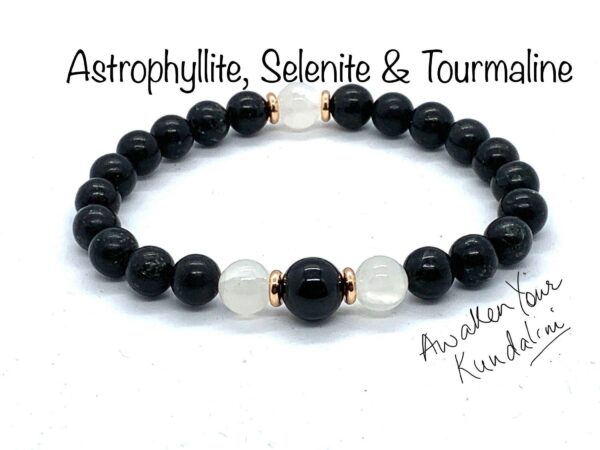 Rare Astrophyllite Selenite & Tourmaline Mala Bracelet featuring genuine Astrophyllite, Selenite, and Black Tourmaline beads, designed for Root and Crown Chakra balance and Capricorn birthstone support.