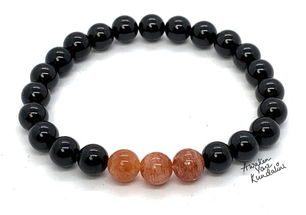 Black Tourmaline & Sunstone Bracelet featuring genuine Black Tourmaline and Sunstone beads, designed for Capricorn Sun Sign and Root Chakra energy enhancement.