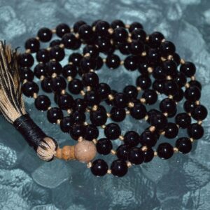 Black Onyx Mala Beads Necklace featuring 108 hand-knotted Black Onyx beads, designed to provide grounding and protection. Ideal for meditation and spiritual practices, aligning with the Root and Solar Plexus Chakras, and resonating with Capricorn and Leo.