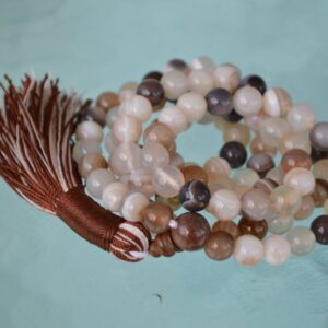 A handcrafted Brown Agate Chakra Necklace with 108 beads, designed to align with the Root and Sacral Chakras, promoting grounding, stability, and emotional balance.