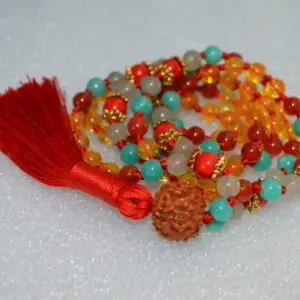 A vibrant Citrine, Coral, Jade, Aventurine, Carnelian, and Rudraksha Mala necklace with 108 beads plus 1 guru bead. Supports the Sacral and Heart Chakras, aligned with Aries and Leo for abundance, vitality, and emotional balance. Handcrafted for meditation and spiritual practice.