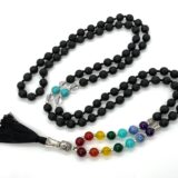 7 Chakra Onyx Gemstone Mala Necklace with 108 hand-knotted beads, balancing all chakras and providing protection, aligned with Leo and Capricorn.