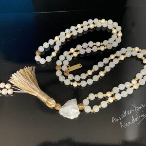 Moonstone & Pearl Mala Necklace featuring natural moonstone and pearl beads, hand-knotted, aligned with Crown and Third Eye Chakras for intuition and emotional balance.