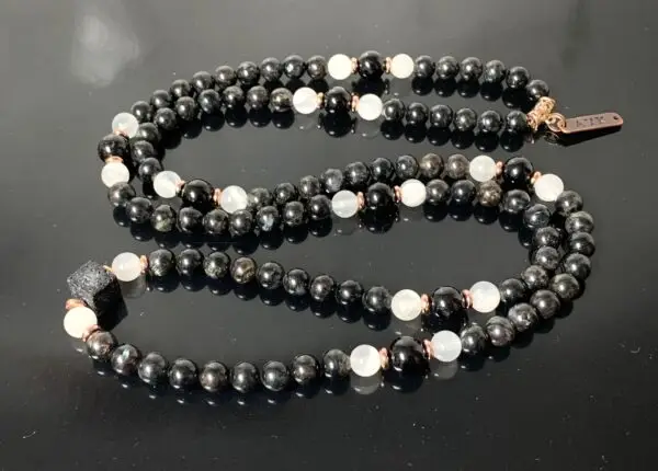  Astrophyllite, Selenite, and Black Tourmaline Mala Necklace featuring genuine beads, designed for Crown and Soul Chakra balance and spiritual growth for Capricorn.