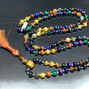 Blue, Black, Grey, Green Tiger's Eye Mala Necklace designed for multi-chakra balancing, offering protection and focus, resonating with Libra and Gemini energies.