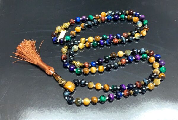 Blue, Black, Grey, Green Tiger's Eye Mala Necklace designed for multi-chakra balancing, offering protection and focus, resonating with Libra and Gemini energies.