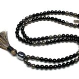 Tourmaline, Pyrite, and Hematite Mala Necklace with 108 hand-knotted beads, designed to activate the Root and Solar Plexus Chakras. Resonates with Capricorn and Scorpio, providing protection, grounding, and inner strength.