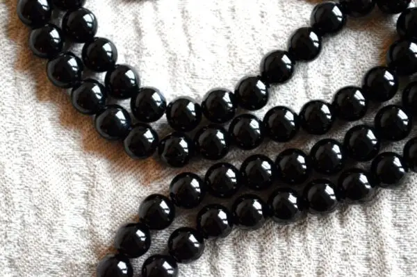 Black Tourmaline Mala Beads Necklace featuring genuine black tourmaline beads, designed for Root Chakra balance, Capricorn & Libra energies, and enhanced grounding and protection.