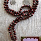 Red Sandalwood (Laal Chandan) Mala Necklace featuring 108 hand-knotted beads designed for grounding and protection. Resonates with Aries and Scorpio zodiac signs.