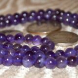 Amethyst Mala Beads Necklace featuring 108 hand-knotted beads, designed to support intuition and spiritual growth, with Third Eye and Crown Chakra alignment, resonating with Pisces and Aquarius.