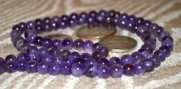 Amethyst Mala Beads Necklace featuring 108 hand-knotted beads, designed to support intuition and spiritual growth, with Third Eye and Crown Chakra alignment, resonating with Pisces and Aquarius.