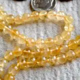 Natural Citrine Crystal Mala Beads Necklace designed for Solar Plexus Chakra support, enhancing confidence, personal power, and abundance, with gemstones resonating with Aries and Leo.