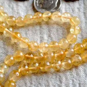 Natural Citrine Crystal Mala Beads Necklace designed for Solar Plexus Chakra support, enhancing confidence, personal power, and abundance, with gemstones resonating with Aries and Leo.