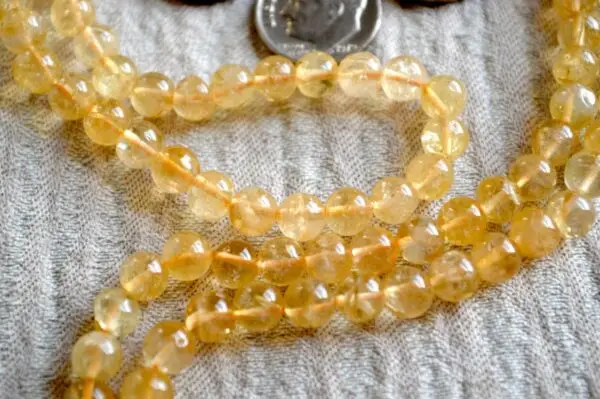 Natural Citrine Crystal Mala Beads Necklace designed for Solar Plexus Chakra support, enhancing confidence, personal power, and abundance, with gemstones resonating with Aries and Leo.