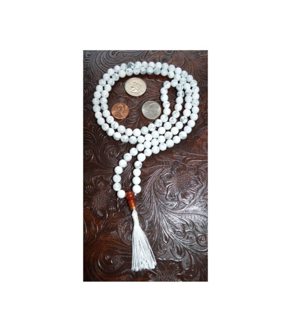 A Howlite Mala Necklace with hand-knotted beads, supporting the Third Eye and Crown Chakras. Resonates with Taurus and Gemini, offering calming and clarity. Ideal for meditation and spiritual practice.