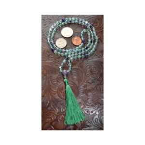 Fluorite Mala Necklace with 108 hand-knotted beads, designed to support Heart and Third Eye Chakra healing, promoting clarity, emotional balance, and spiritual growth, resonating with Pisces and Capricorn.