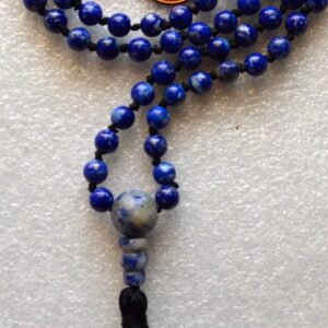 A Lapis Lazuli Mala Necklace featuring 108 beads plus 1 guru bead. This necklace supports the Third Eye and Throat Chakras, resonates with Sagittarius and Libra, and enhances intuition, clarity, and communication. Handcrafted for quality and comfort, suitable for meditation and spiritual practice.