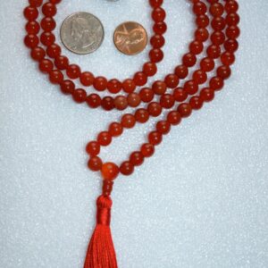 Carnelian Mala Beads Necklace featuring 108 hand-knotted beads, designed to activate the Sacral Chakra for enhanced motivation and creativity, associated with Taurus energy.