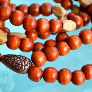 Wooden Mala Beads Necklace designed for Root Chakra grounding, enhancing stability, strength, and a deep connection to the earth, resonating with Capricorn and Taurus.