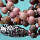 Rhodonite and Jasper Hand Knotted Bhakti Mala Beads Necklace featuring genuine rhodonite and jasper beads, designed for Heart and Root Chakra balance and Taurus emotional healing.