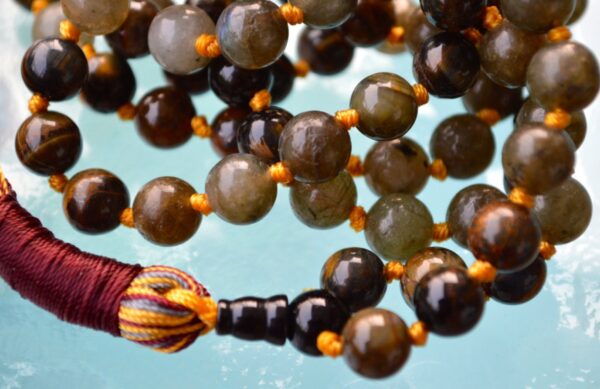 Hand-knotted Labradorite and Tiger Eye Mala Necklace with shimmering blue-gray and golden-brown beads, designed for protection, confidence, and spiritual insight. Ideal for meditation and chakra balancing.