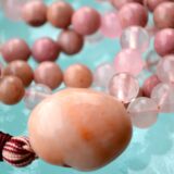 Rhodonite & Rose Quartz Mala Necklace, designed for Heart Chakra healing, promoting love, emotional balance, and self-compassion, with gemstones resonating with Taurus and Libra.