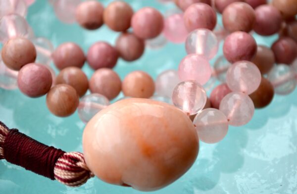 Rhodonite & Rose Quartz Mala Necklace, designed for Heart Chakra healing, promoting love, emotional balance, and self-compassion, with gemstones resonating with Taurus and Libra.