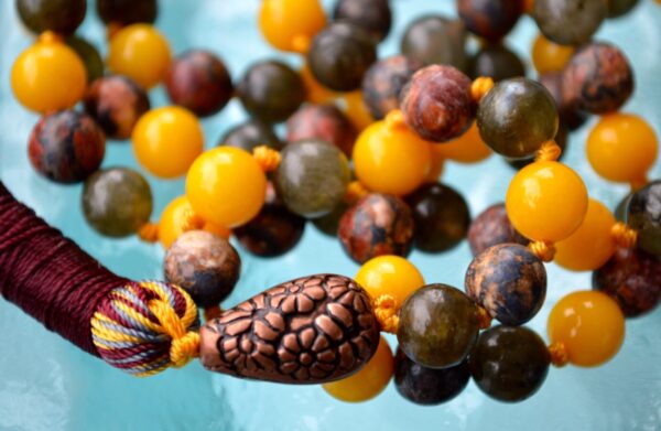 Labradorite, Jade & Leopard Skin Jasper Mala Necklace featuring 108 hand-knotted beads, designed for transformation and harmony. Ideal for meditation and spiritual practices, aligning with the Heart and Root Chakras, and resonating with Pisces and Aries