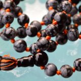 Snowflake Obsidian Mala Beads Necklace designed for Root and Sacral Chakra support, promoting balance, protection, and emotional stability, with stones resonating with Capricorn and Virgo.