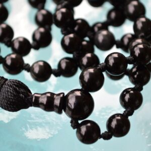 Black Onyx Mala Necklace featuring 108 hand-knotted beads, designed for protection and grounding, with a tassel for added elegance.