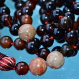 Natural Agate & Unakite Mala Necklace featuring 108 hand-knotted Agate and Unakite beads, designed for emotional healing and grounding. Aligns with the Heart and Root Chakras, resonating with Scorpio and Virgo. Perfect for meditation and spiritual growth.