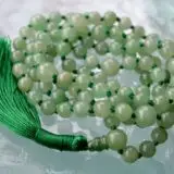 A smooth Green Aventurine Mala Necklace with 108 beads plus 1 guru bead. This necklace supports the Heart Chakra, resonates with Virgo, and promotes prosperity, emotional healing, and love. Handcrafted for comfort and quality, ideal for meditation and spiritual practice.