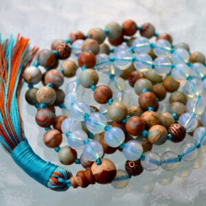 Blue Opal & Aqua Terra Mala Necklace designed for Throat Chakra support, enhancing communication and emotional balance, with gemstones resonating with Gemini and Pisces energies.