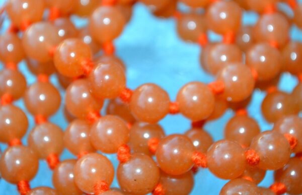 Orange Jade | Sacral Chakra Mala Necklace with Carnelian and Moonstone beads, designed for Sacral Chakra balance, Cancer & Leo energies, and enhanced creativity and emotional balance.