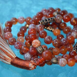 Red Fire Agate Mala Necklace designed for Root Chakra support, offering grounding, protection, and emotional balance, with stones resonating with Aries and Scorpio.