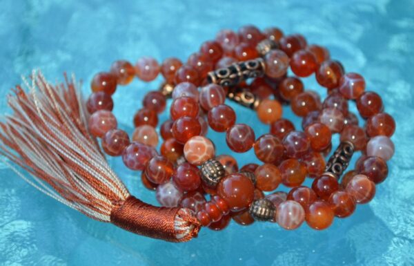 Red Fire Agate Mala Necklace designed for Root Chakra support, offering grounding, protection, and emotional balance, with stones resonating with Aries and Scorpio.