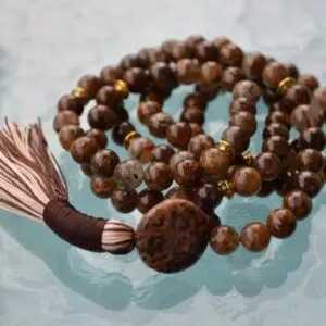 A Picture Jasper Mala Necklace with 108 beads, associated with the Root Chakra, designed for Taurus zodiac signs, promoting grounding and stability.