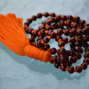 Rosewood Mala Beads Necklace with 108 hand-knotted beads, designed for stability and grounding, finished with a classic tassel.