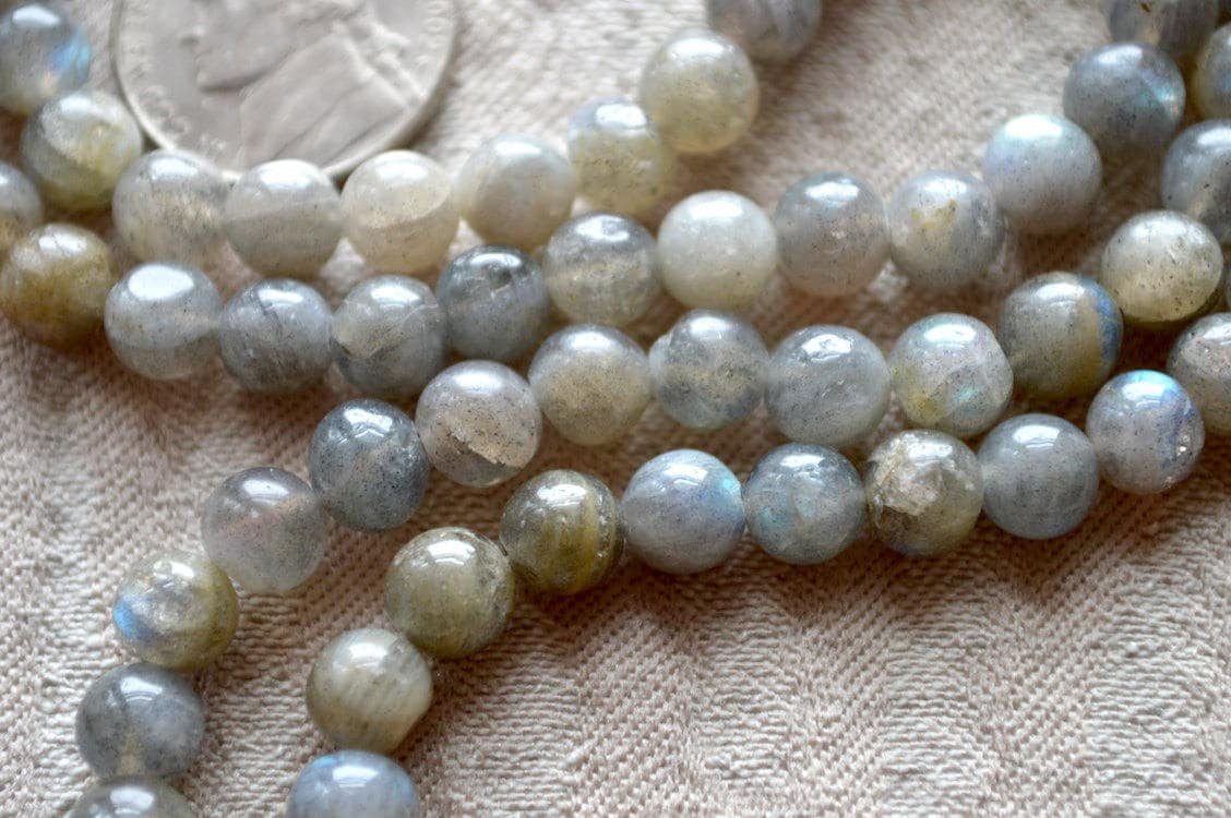 Labradorite Mala Necklace featuring 108 hand-knotted Labradorite beads, designed to enhance transformation and intuition. Ideal for meditation and spiritual practices, aligning with the Third Eye and Crown Chakras, and resonating with Leo and Scorpio.