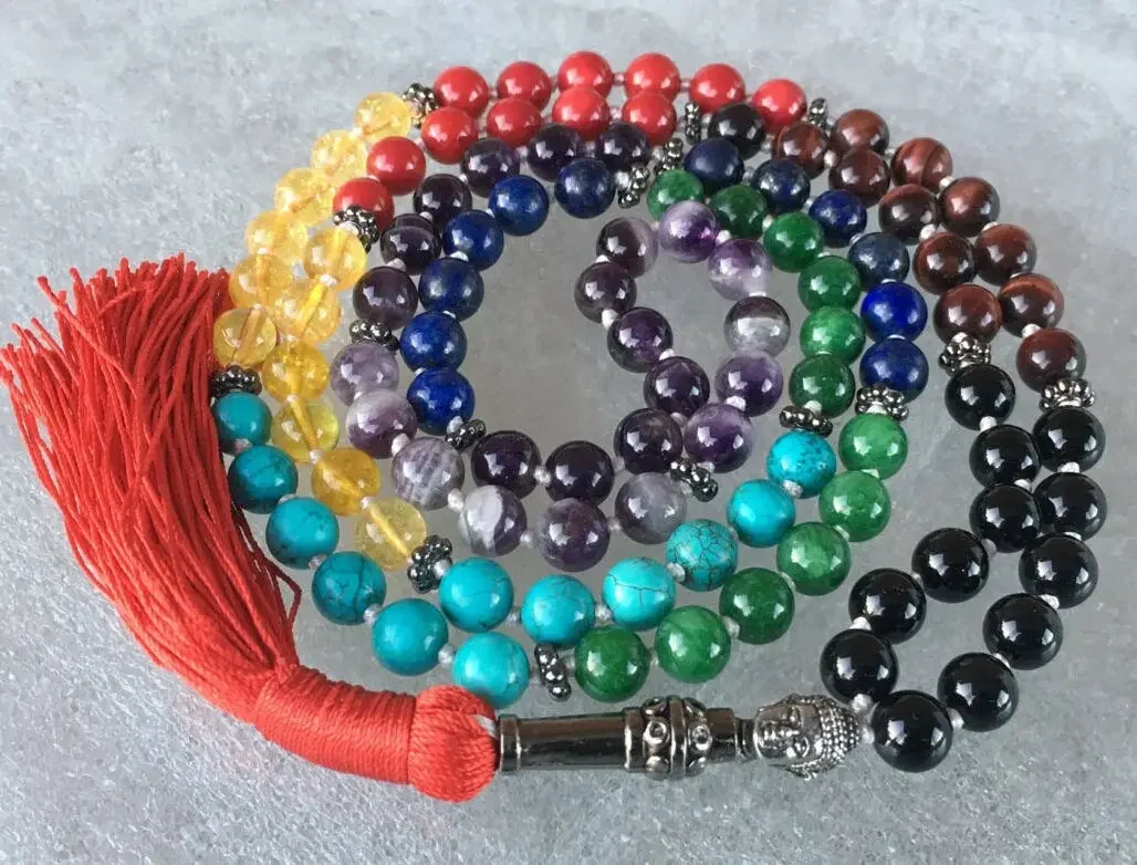 A Buddha Seven Chakra Knotted Beads Necklace featuring seven distinct beads, each representing one of the seven chakras, designed for universal balance and enlightenment.