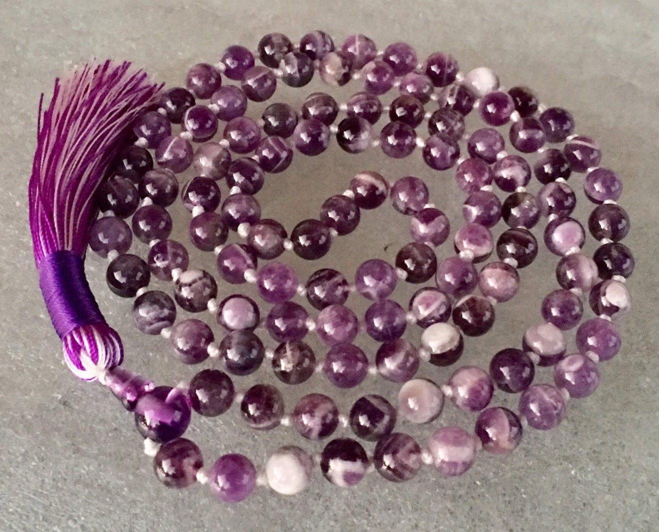 Chevron Amethyst Mala Necklace, harmonizing with Third Eye and Crown Chakras, ideal for Pisces and Aquarius zodiac signs, promoting intuition and spiritual growth.