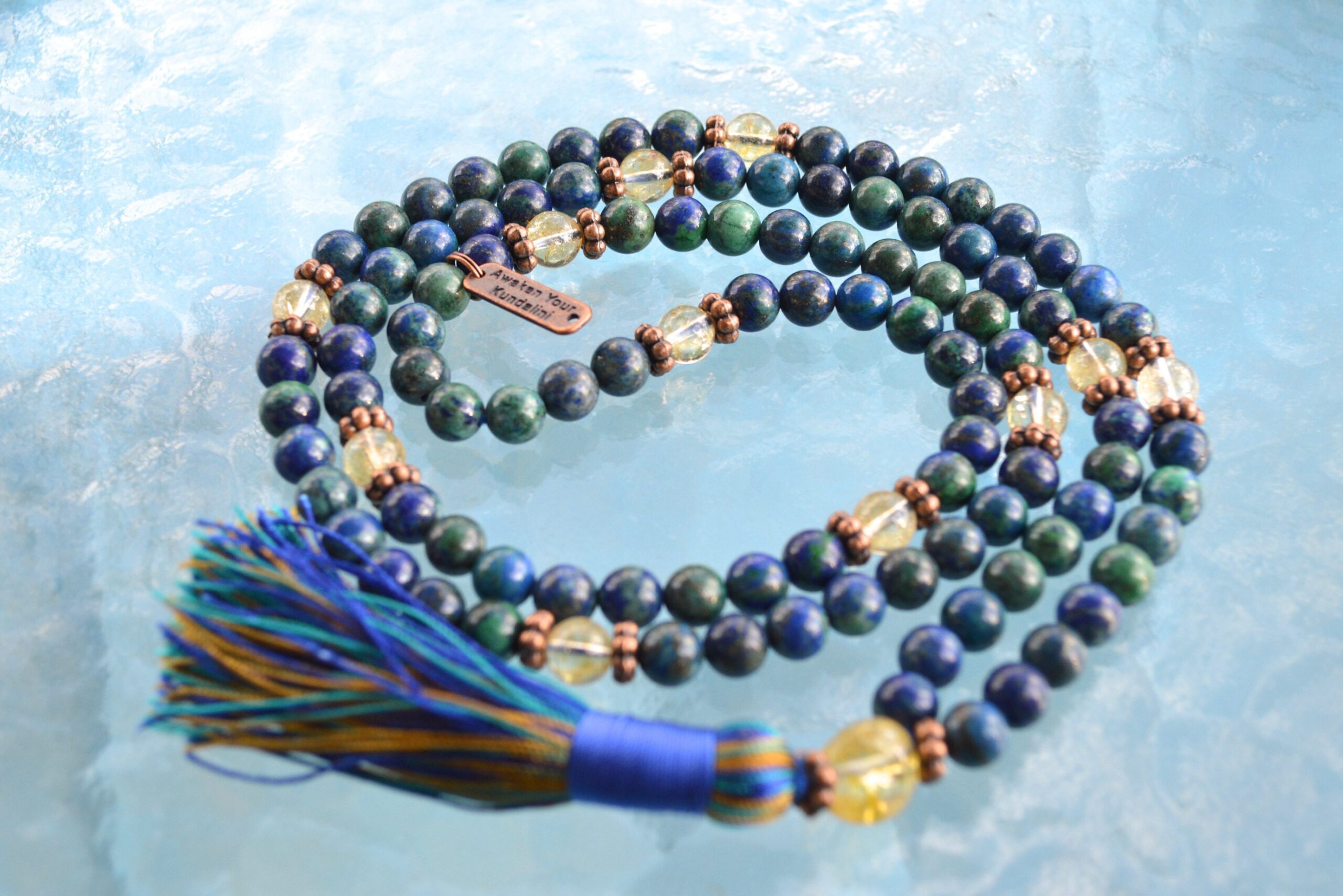 Hand-knotted Azurite & Citrine Mala Necklace featuring 108 beads, supporting Third Eye and Solar Plexus chakras, associated with Sagittarius and Leo, enhancing intuition and abundance.