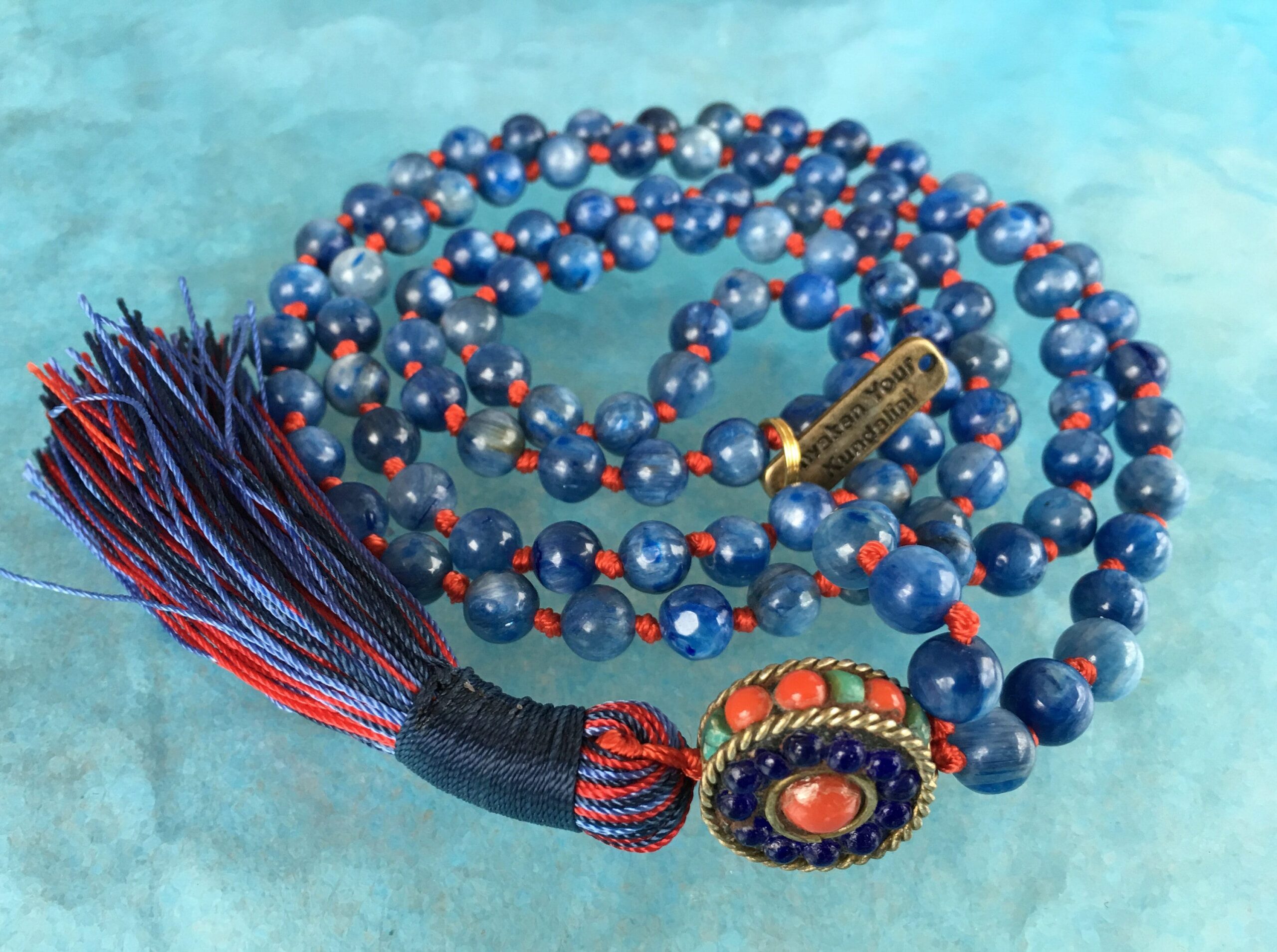 Kyanite Mala Beads Necklace focusing on Throat Chakra balance, enhancing communication and promoting inner peace. Ideal for Libra and Aries, with hand-knotted blue Kyanite beads.