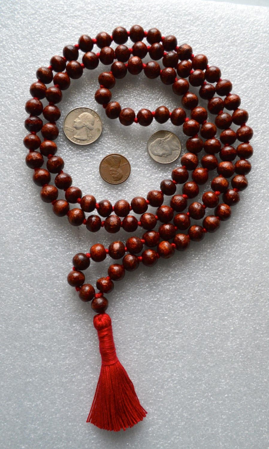 Bodhi Beads Mala Necklace featuring 108 hand-knotted Bodhi seeds, designed for enlightenment and spiritual awakening. Aligns with the Crown Chakra and resonates with Sagittarius and Pisces. Ideal for meditation and spiritual growth.