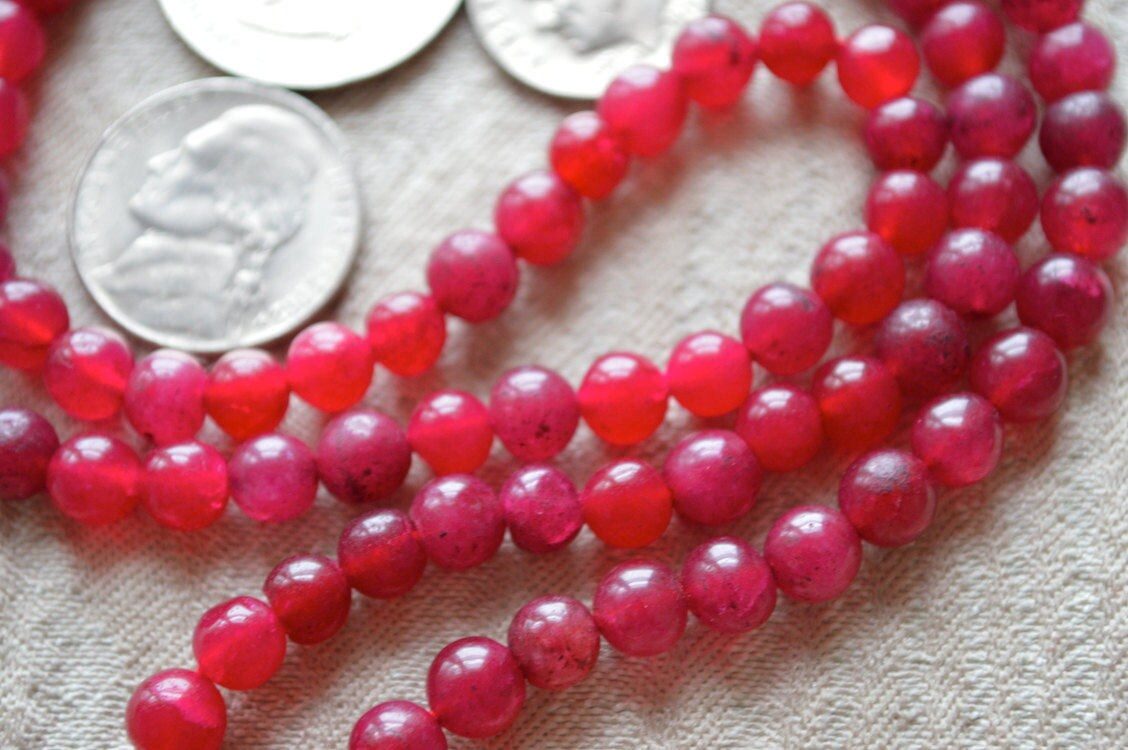 Red Jade Mala Necklace featuring 108 hand-knotted beads designed for strength, passion, and vitality. Resonates with Aries and Scorpio zodiac signs.