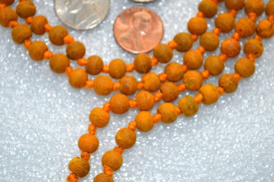 Haldi (Turmeric) Mala Beads Necklace made from natural turmeric beads, aligned with the Solar Plexus Chakra for purification and protection, ideal for Leo and Sagittarius zodiac signs.